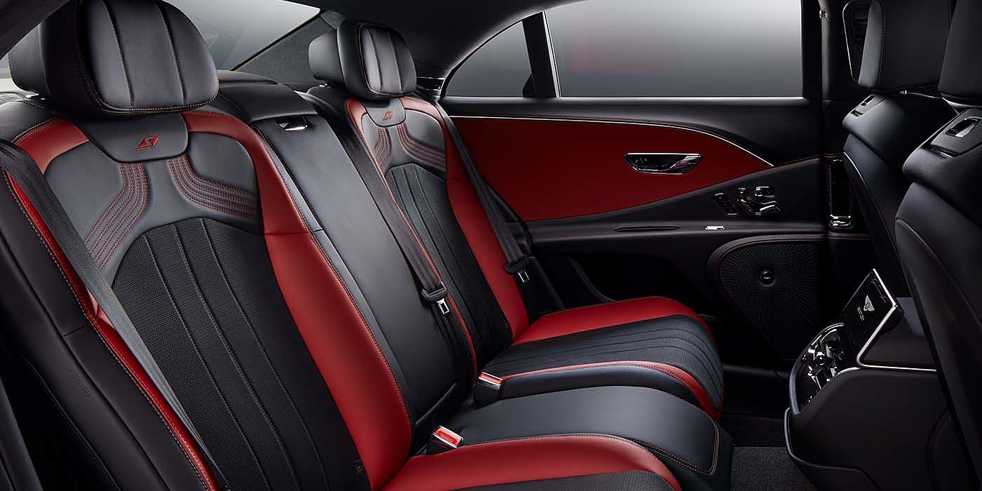 Bentley Brisbane Bentley Flying Spur S sedan rear interior in Beluga black and Hotspur red hide with S stitching