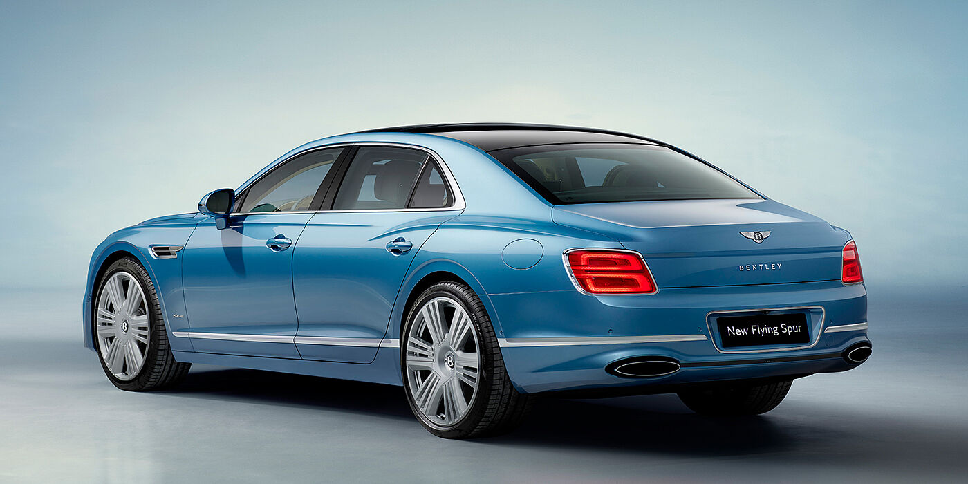 Bentley Brisbane New Bentley Flying Spur Azure sedan rear view in Light windsor blue by Mulliner paint with 22 inch Azure wheels and chrome exterior details