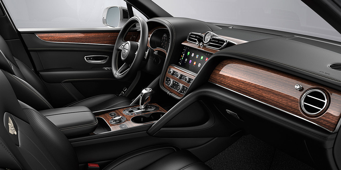 Bentley Brisbane Bentley Bentayga interior with a Crown Cut Walnut veneer, view from the passenger seat over looking the driver's seat.