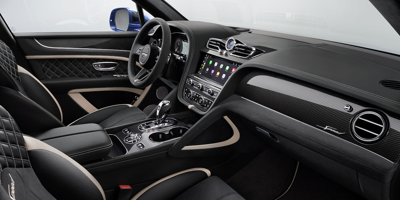 Bentley Brisbane Bentley Bentayga Speed SUV front interior in Beluga black and Linen hide with carbon fibre veneer