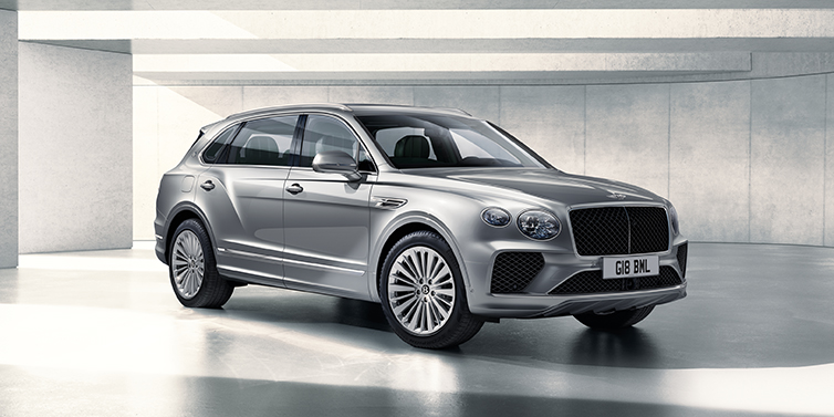 Bentley Brisbane Bentley Bentayga Extended Wheelbase SUV front three quarter in Moonbeam paint with a grey background
