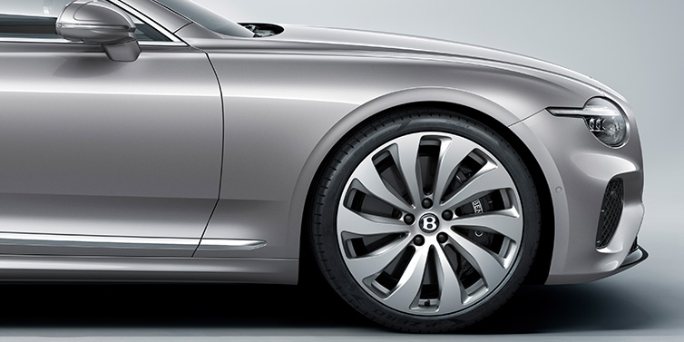 Bentley Brisbane New Bentley Continental GT coupe side view featuring bonnet in Silverlake paint and 22 inch ten spoke silver painted and bright machined wheel