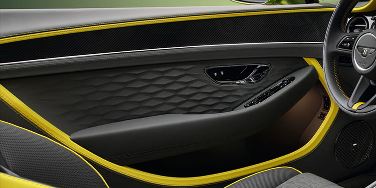 Bentley Brisbane Bentley Continental GTC Speed convertible interior door details featuring Gravity Grey and Cyber Yellow by Mulliner hides and high gloss carbon fibre veneer