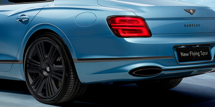 Bentley Brisbane New Bentley Flying Spur Azure sedan in Light windsor blue by Mulliner paint and Black Specification, showing 22 inch Black Azure wheel, black exhaust pipes and exterior features