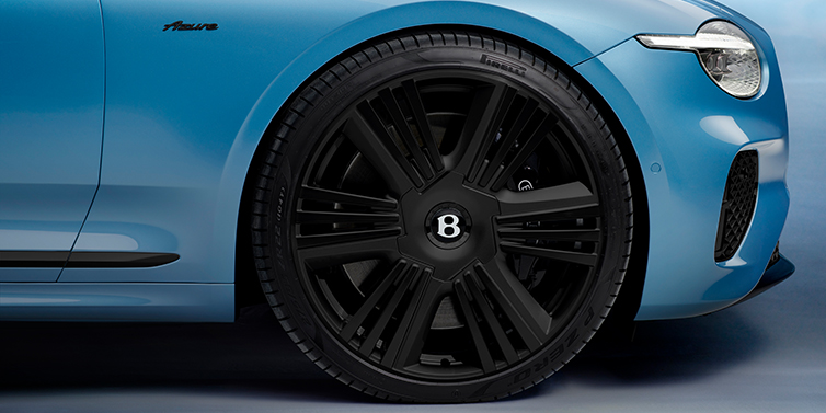 Bentley Brisbane New Bentley Continental GTC Azure convertible front wheel detail with 22 inch black ten spoke wheel and dark chrome details against Light Windsor blue paint