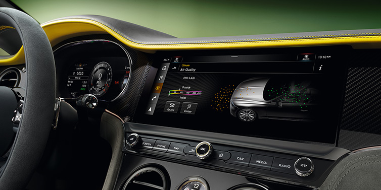 Bentley Brisbane Bentley Continental GTC Speed convertible front interior centre console with MMI screen showing Air Quality visualisation surrounded by Cyber Yellow by Mulliner and Gravity Grey hides and high gloss carbon fibre veneer