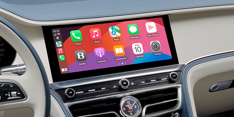 Bentley Brisbane New Bentley Flying Spur Azure sedan front cabin central MMI screen showing available services against Linen and Brunel hides and Piano Linen veneer