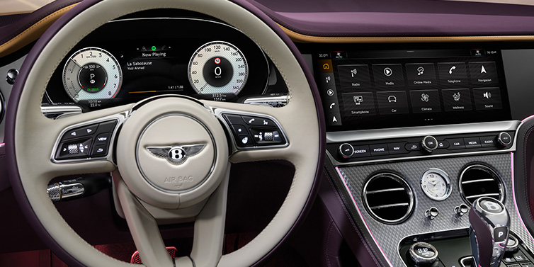 Bentley Brisbane Bentley Continental GTC Mulliner convertible steering wheel and drivers screens surrounded by Damson purple and Linen hides